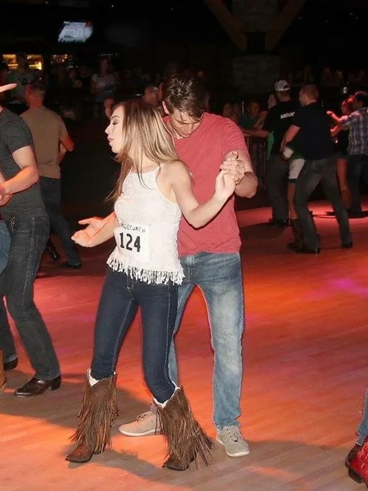 a group of people standing in front of a crowd