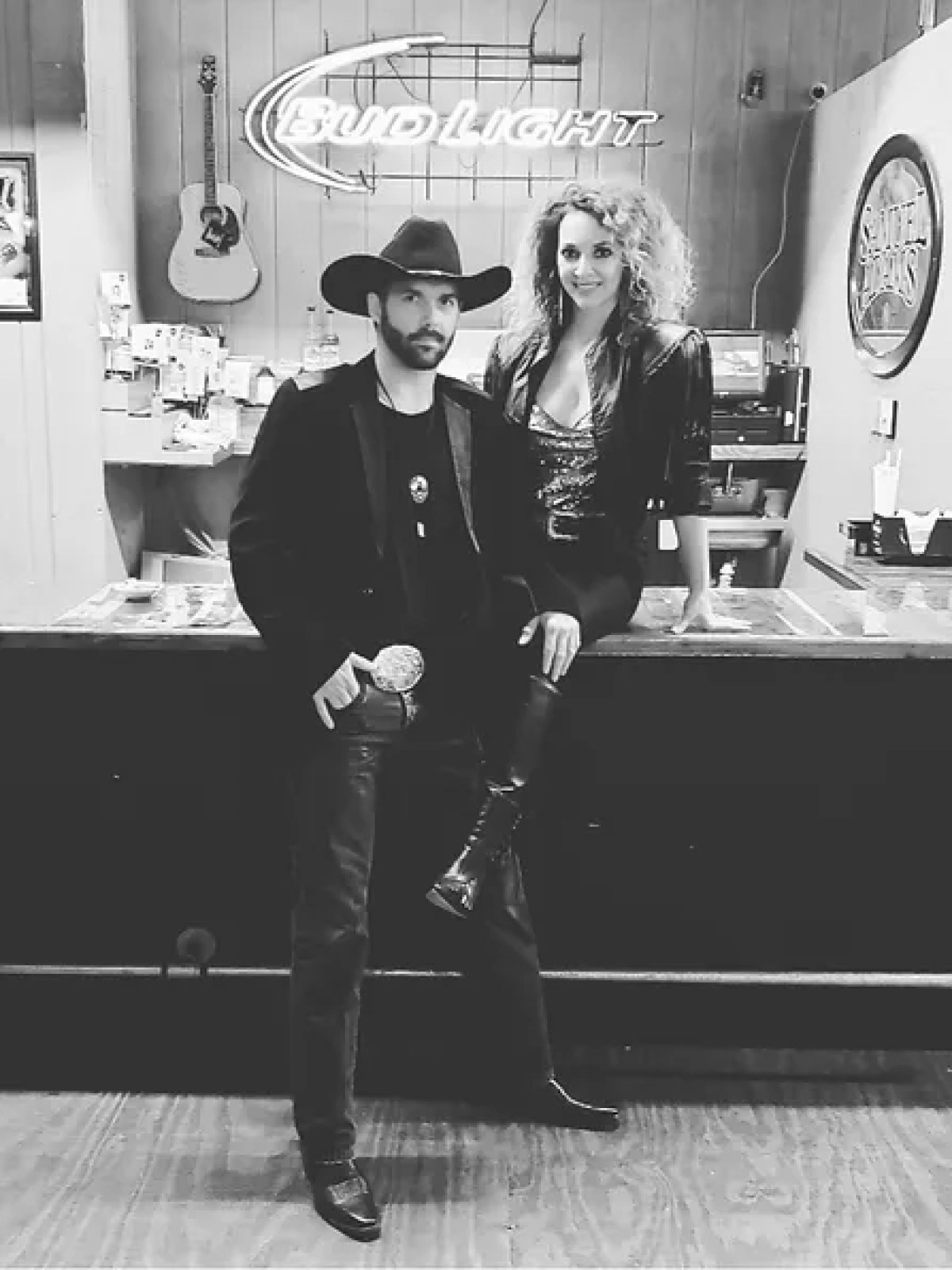 a man and a woman standing in front of a store