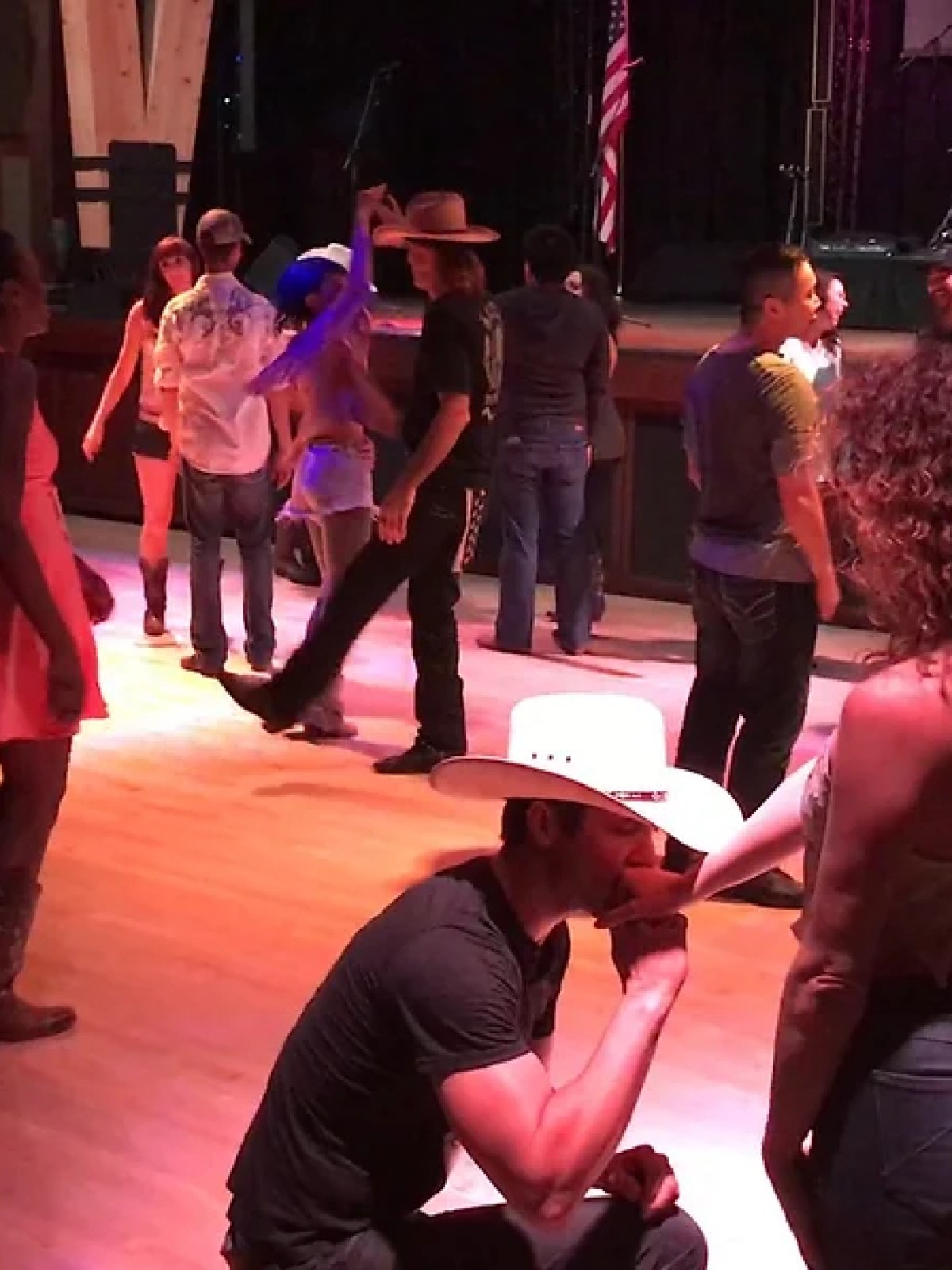 a group of people performing on stage in front of a crowd