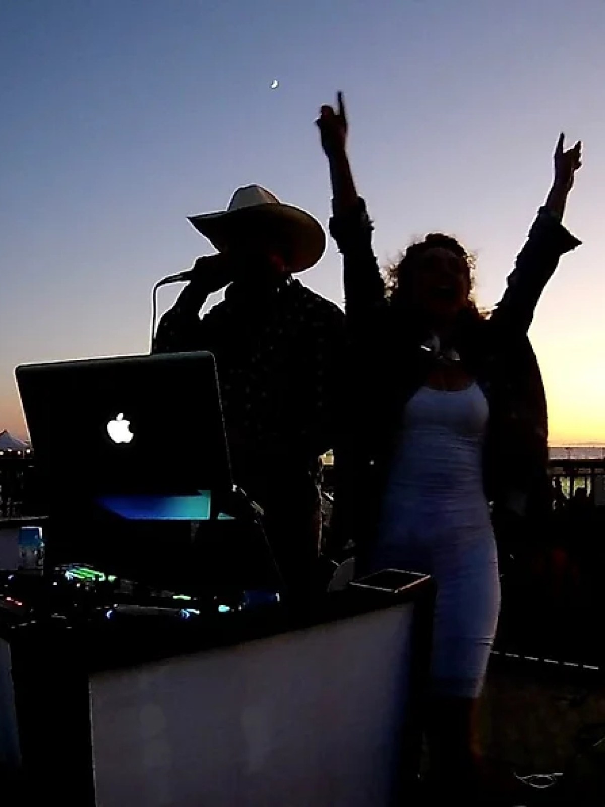 a person standing in front of a laptop