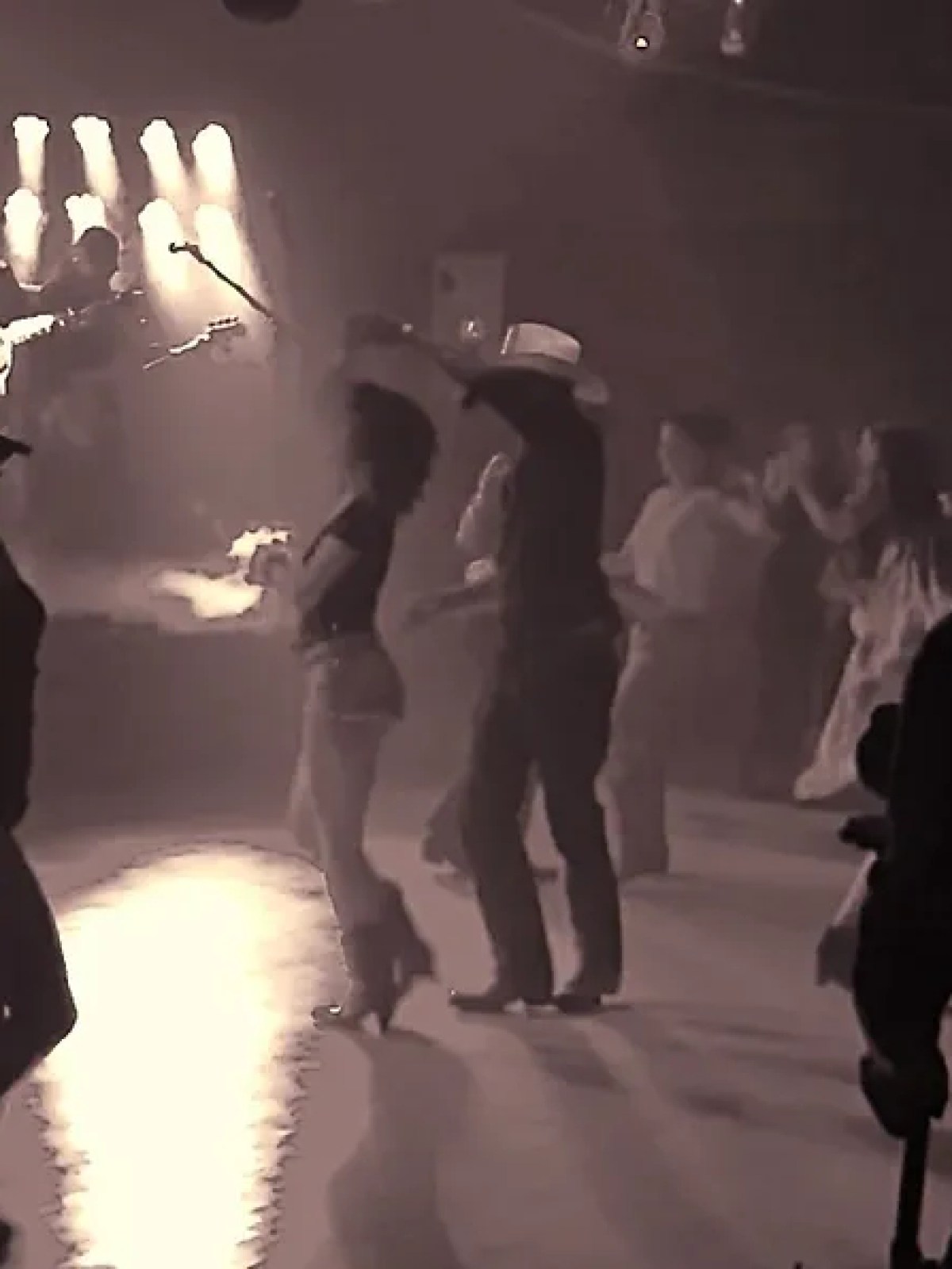 a group of people standing in front of a crowd