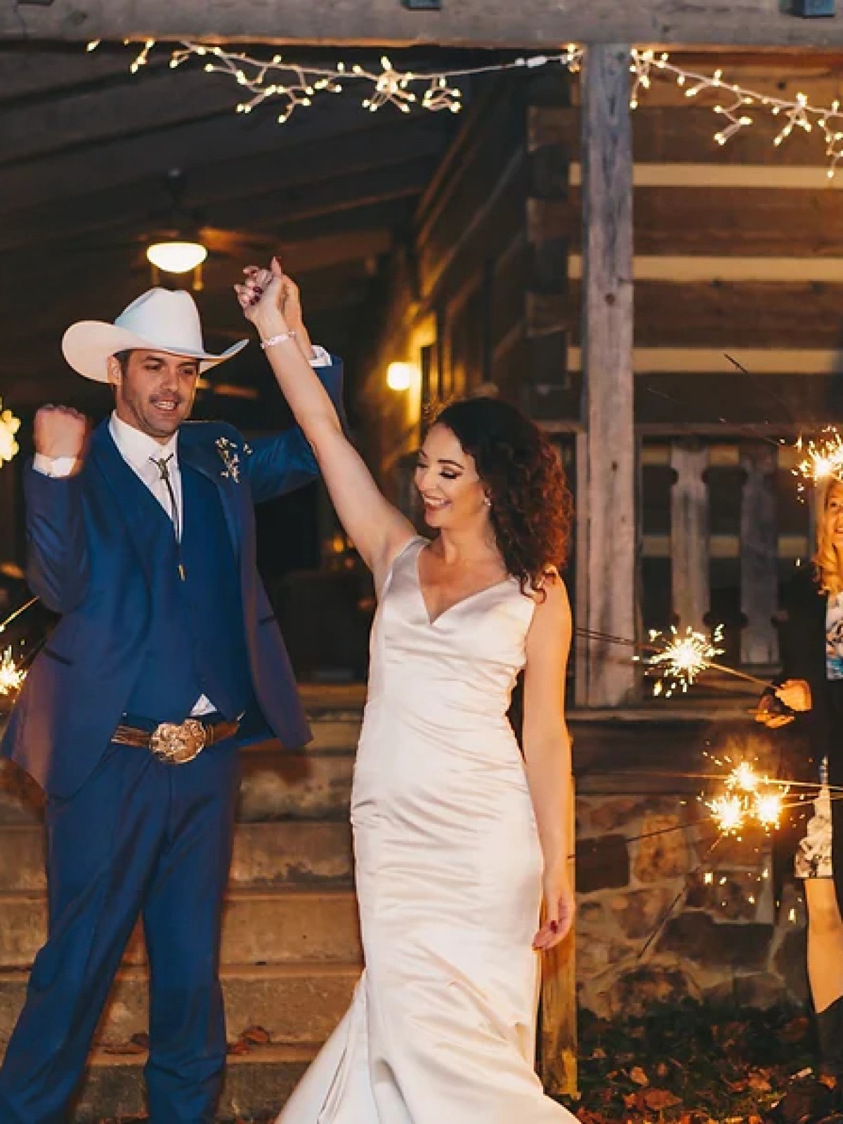 a group of people standing around a fire
