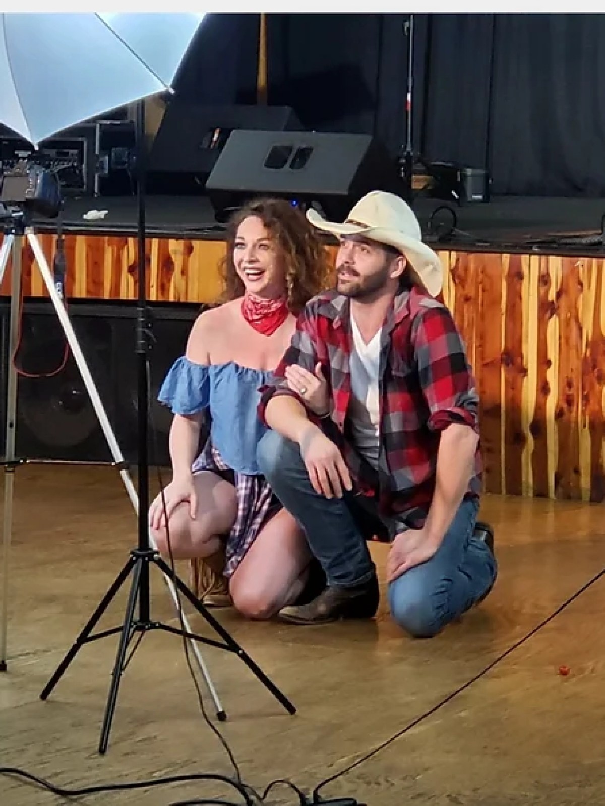 a person standing in front of a tripod