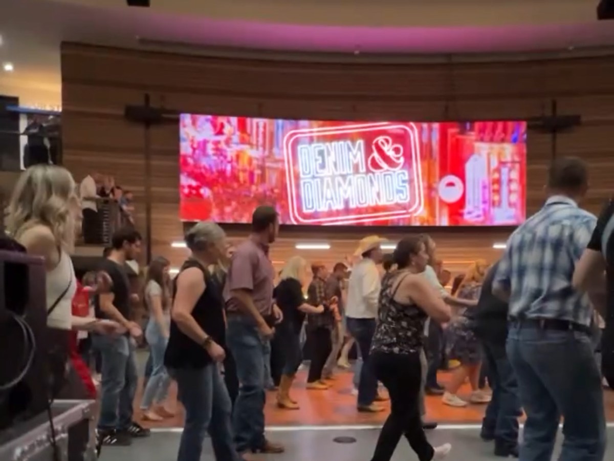 a group of people standing in a room