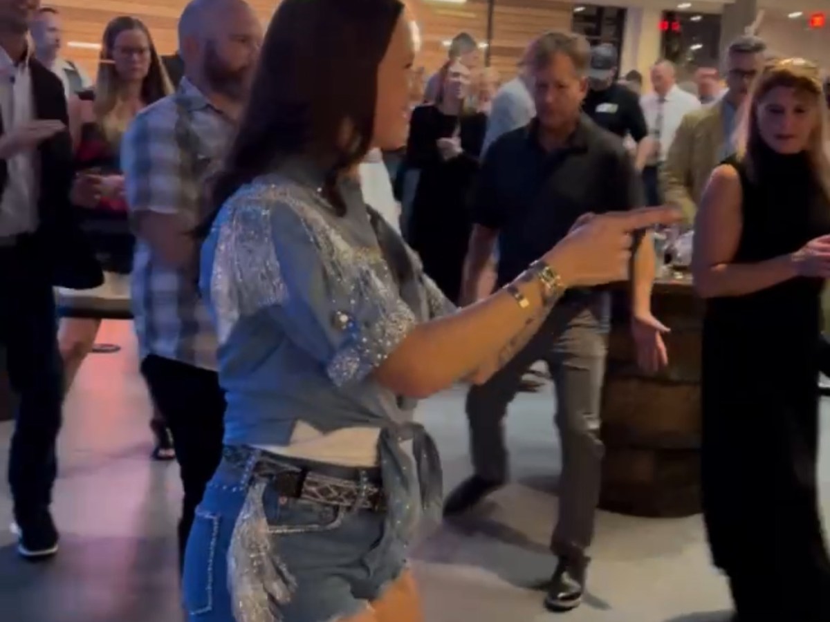 a group of people standing in a room