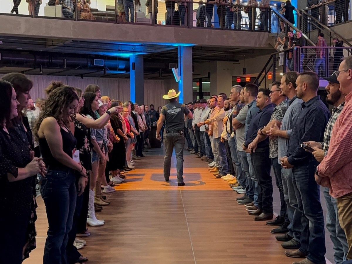 a group of people standing in front of a crowd