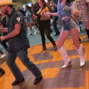 a group of people standing on the floor