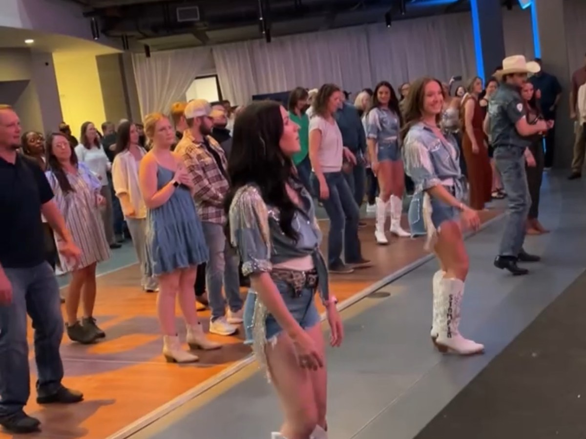 a group of people standing in a room