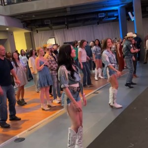 a group of people standing in a room