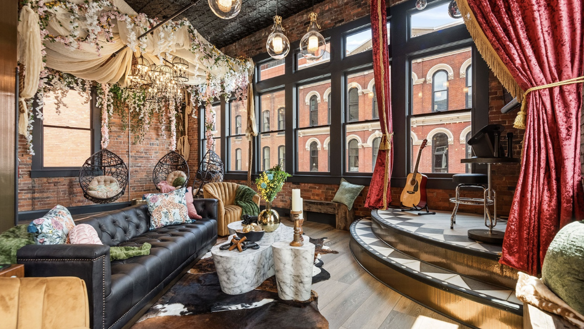 a living room filled with furniture and a fire place